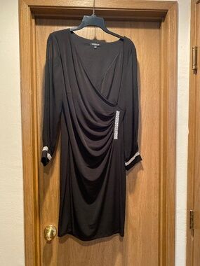 Black, long sleeve cocktail dress with rhinestone embellishment size 8